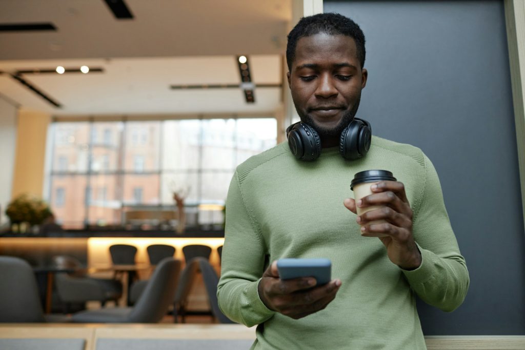 Black Man Using Smartphone